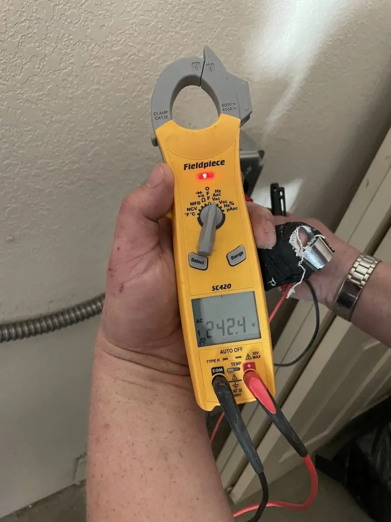 Voltage testing with clamp meter during Outlet Installation in Cherryvale